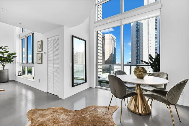a view of a dining room with furniture and window