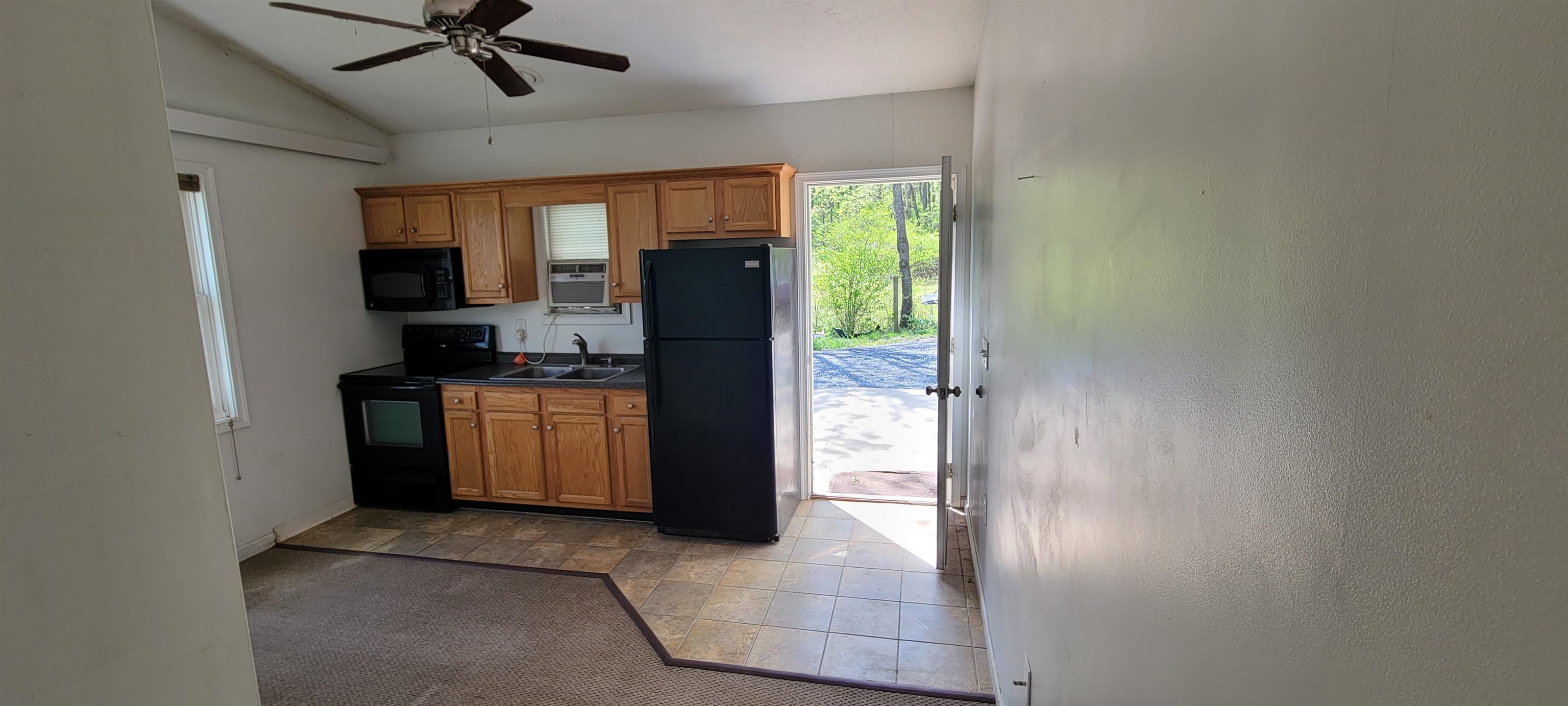 554 Middlebrook Road Staunton, VA 24401 - Photo 4 of 13 a kitchen with a refrigerator and a stove