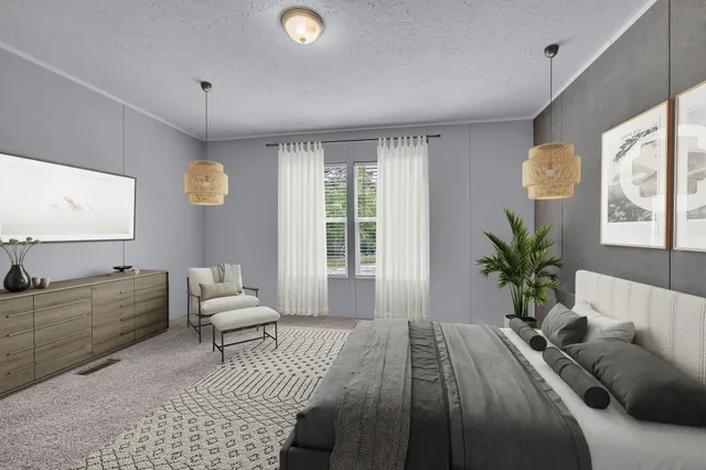 a bedroom with a bed and a couch