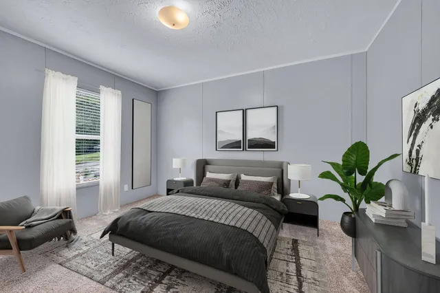 a bedroom with a large bed and a couch