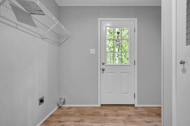 a view of room with window and hardwood floor