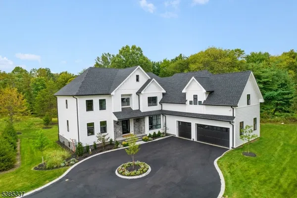 an aerial view of a house with garden