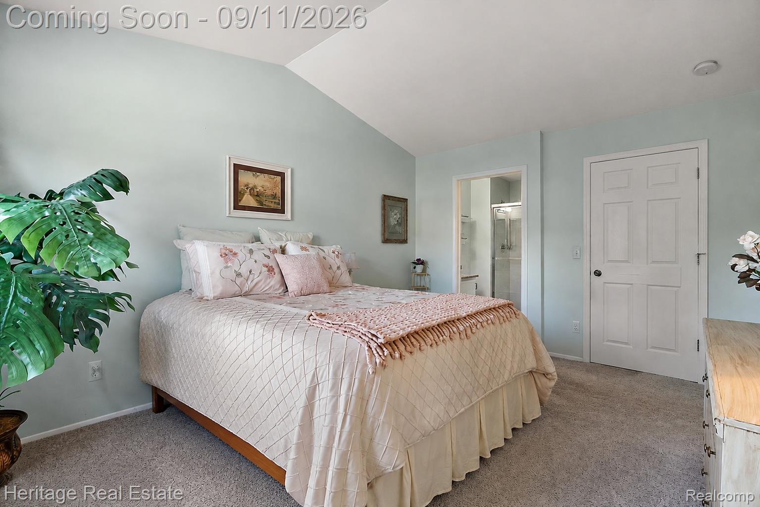 3088 High Pointe Ridge Road Lake Orion, MI 48359 - Photo 13 of 31 Carpeted bedroom featuring a vaulted ceiling, light blue walls, and a paneled door