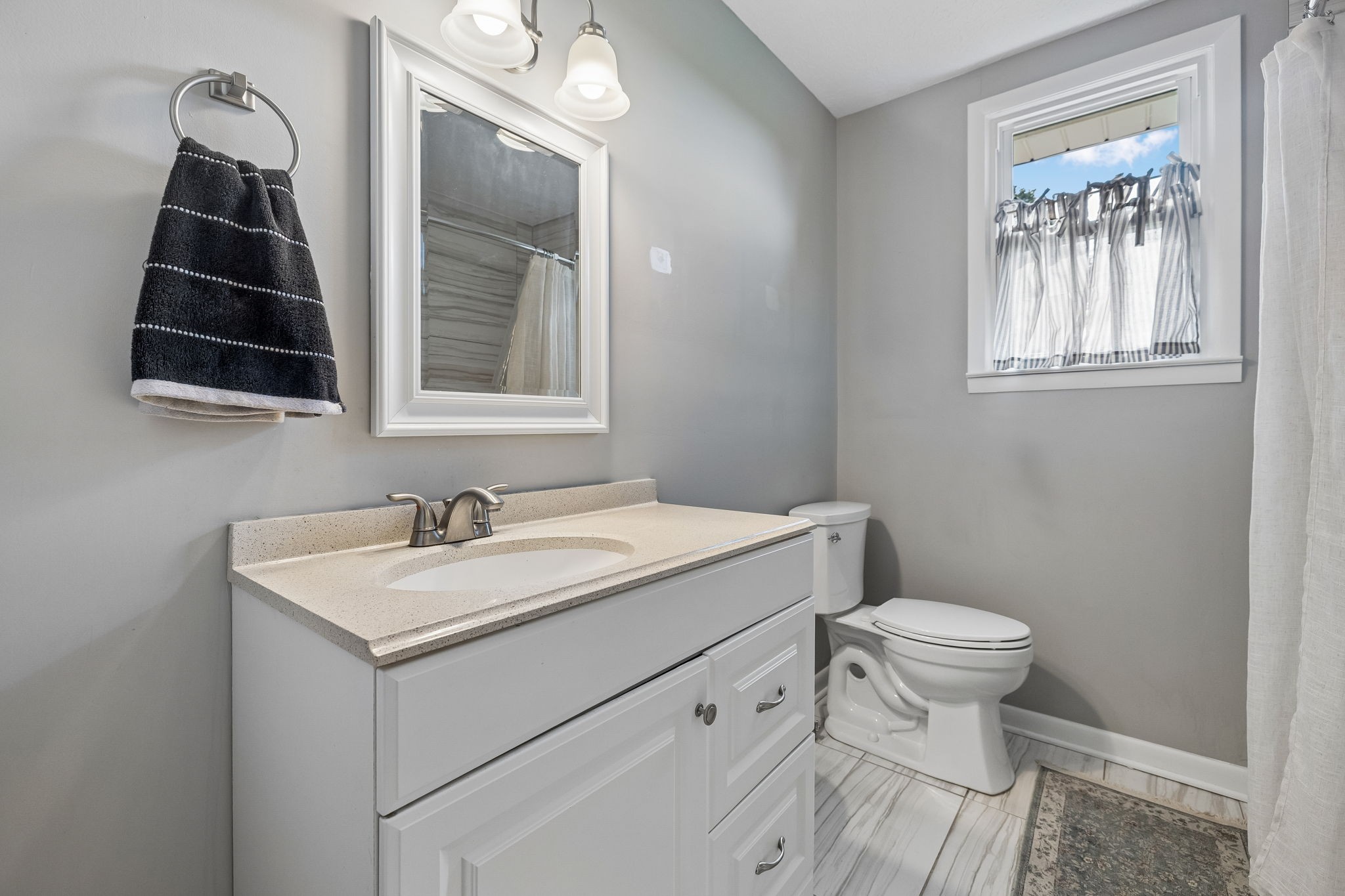 1326 Shahan Road Pleasant View, TN 37146 - Photo 17 of 41 a bathroom with a sink toilet and vanity