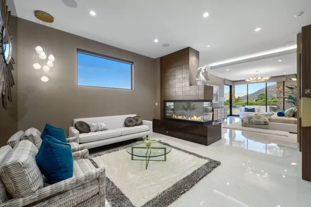 a spacious bathroom with a sink a toilet a mirror and a shower