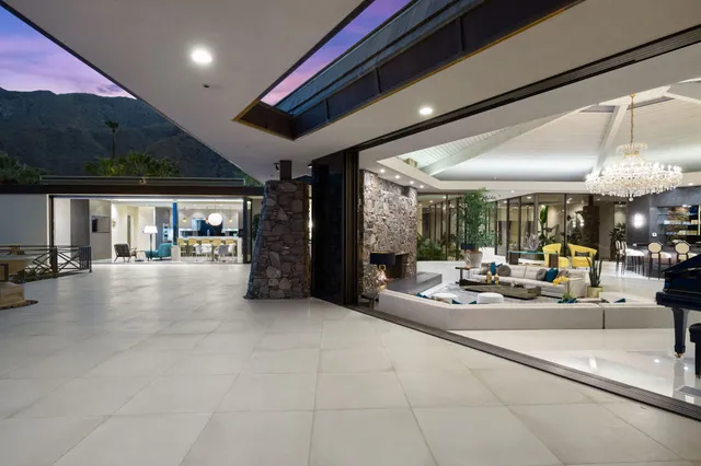 a lobby with furniture and floor to ceiling window