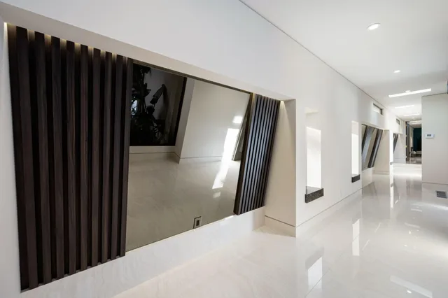 a bathroom with a granite countertop sink mirror and shower