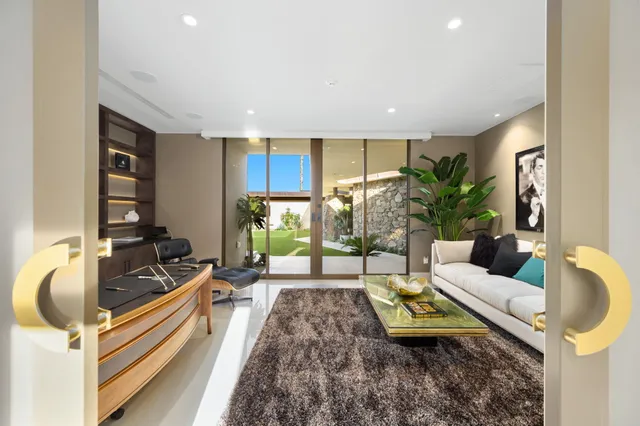 a bed room with a bed and a television