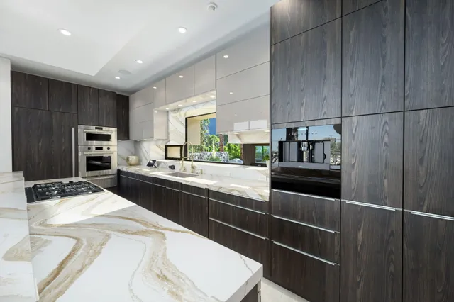 a bedroom with furniture and a flat screen tv