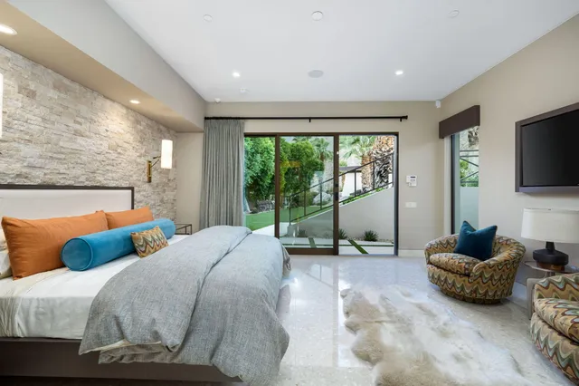 an aerial view of a house with outdoor space patio and swimming pool