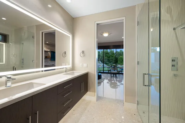 a view of a swimming pool with a table and chairs