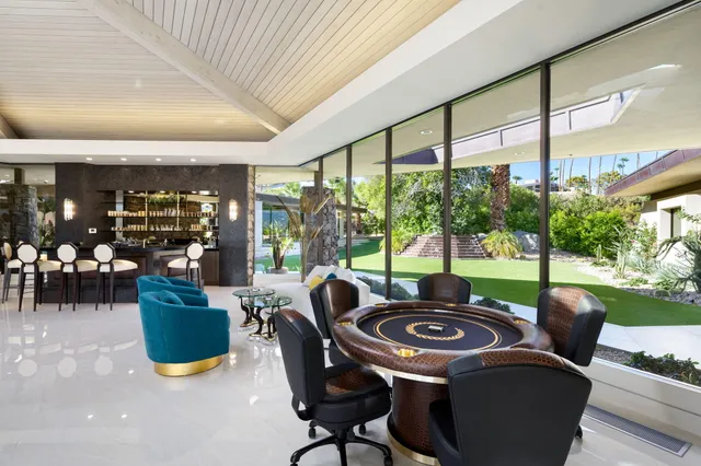 a living room with furniture flowerpot and window