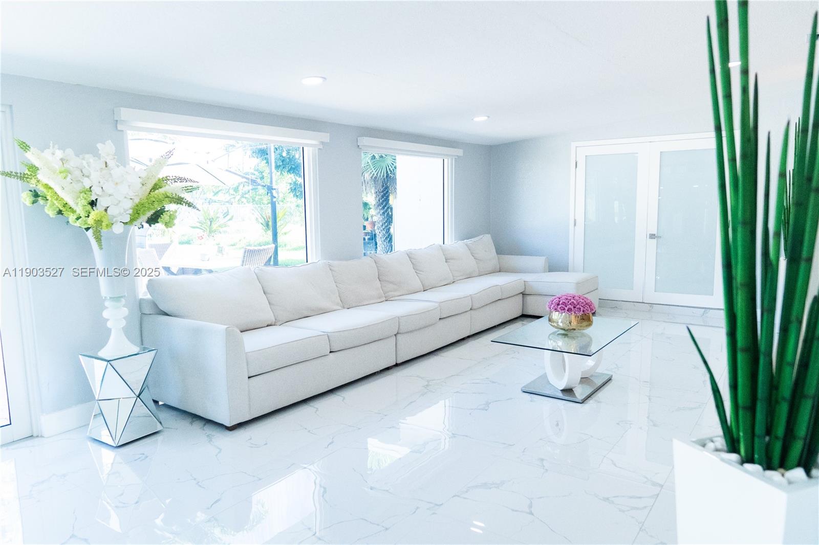 19245 Southwest 188th Street Miami, FL 33187 - Photo 13 of 38 a living room with furniture and a potted plant