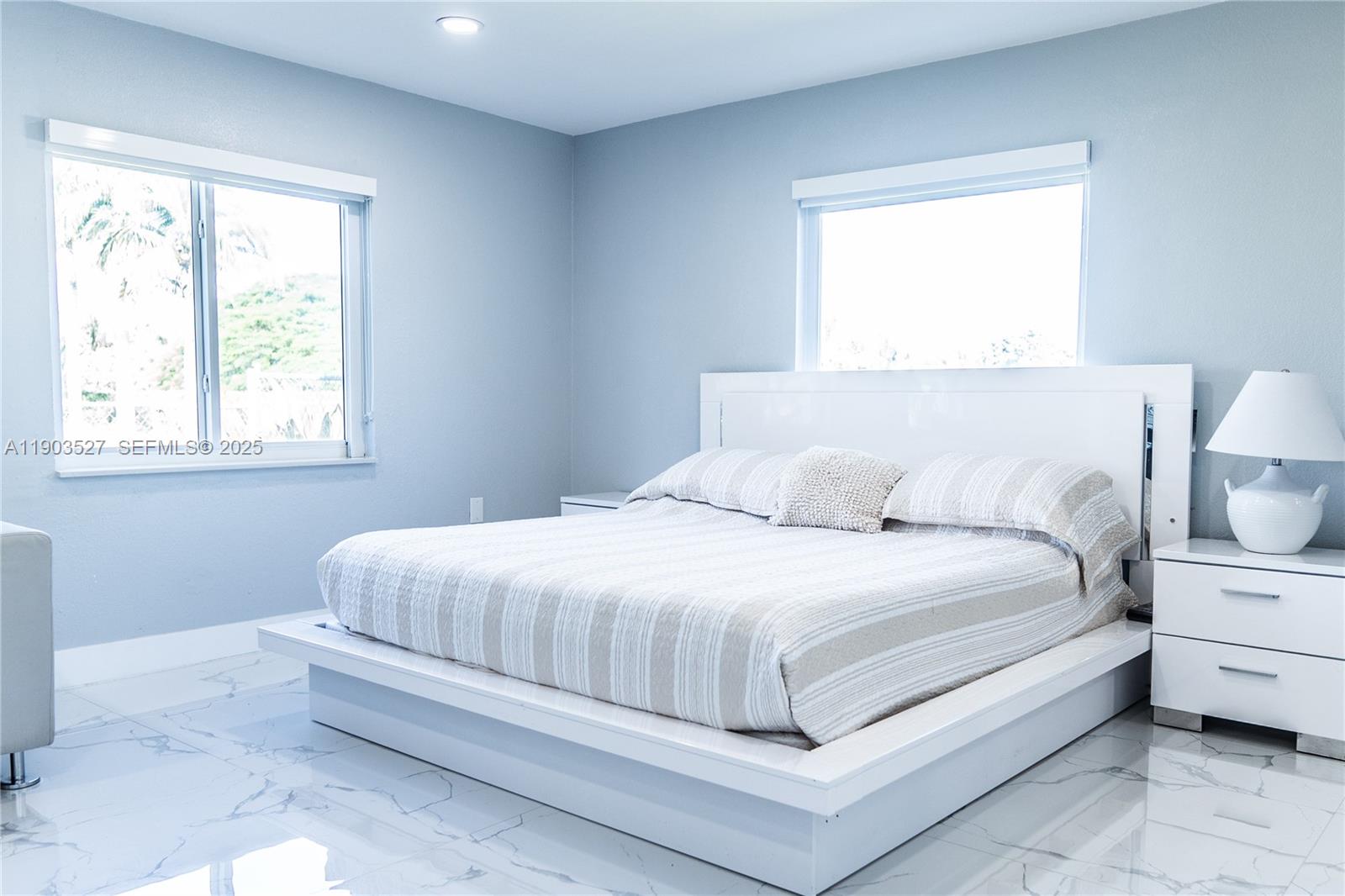 19245 Southwest 188th Street Miami, FL 33187 - Photo 18 of 38 a bedroom with a bed and a window