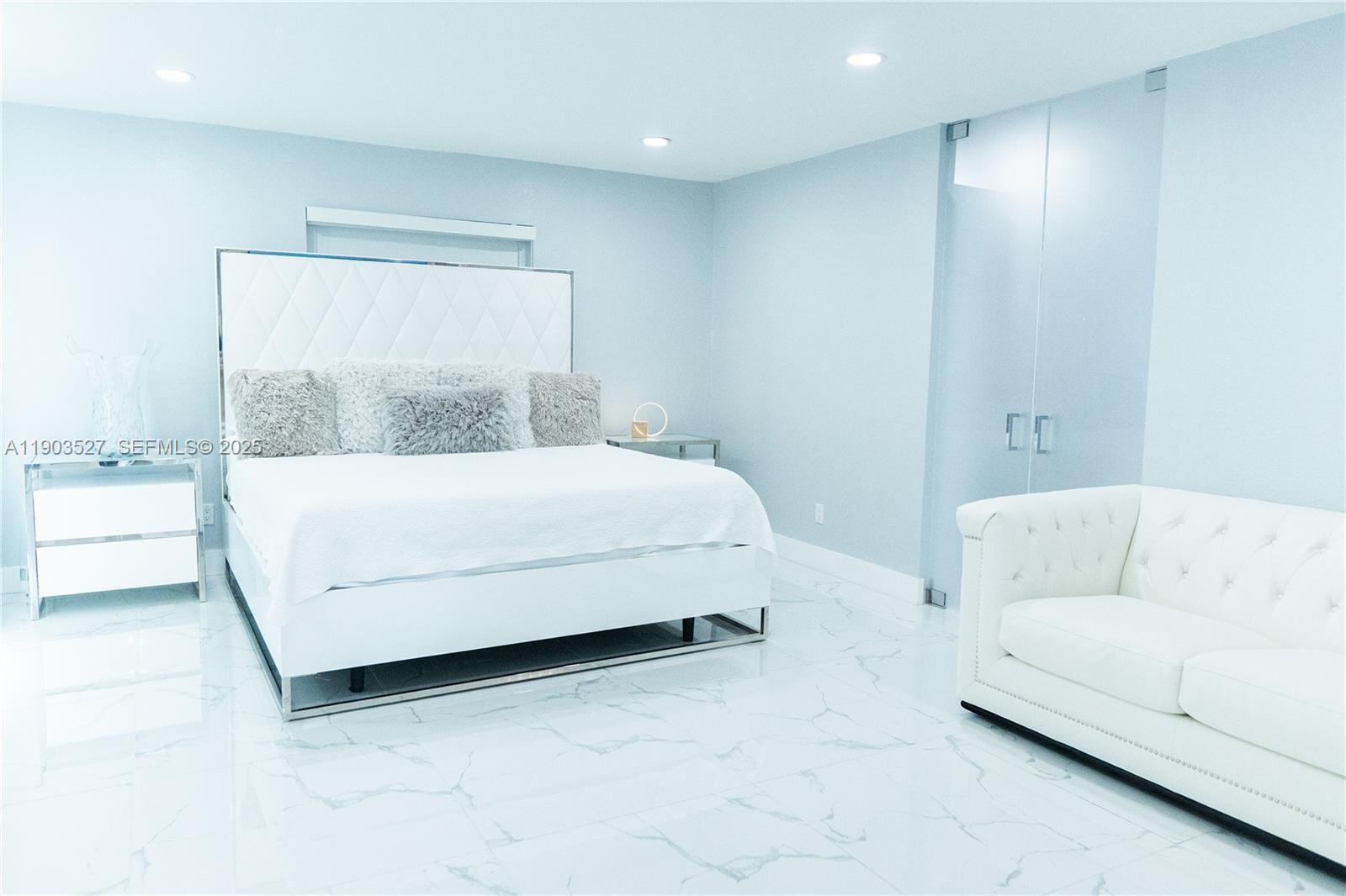 19245 Southwest 188th Street Miami, FL 33187 - Photo 21 of 38 a bedroom with a bed and a couch