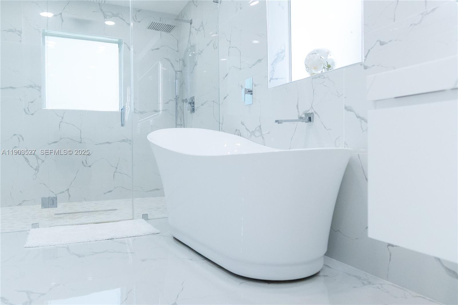 19245 Southwest 188th Street Miami, FL 33187 - Photo 23 of 38 a white bath tub sitting in a bathroom