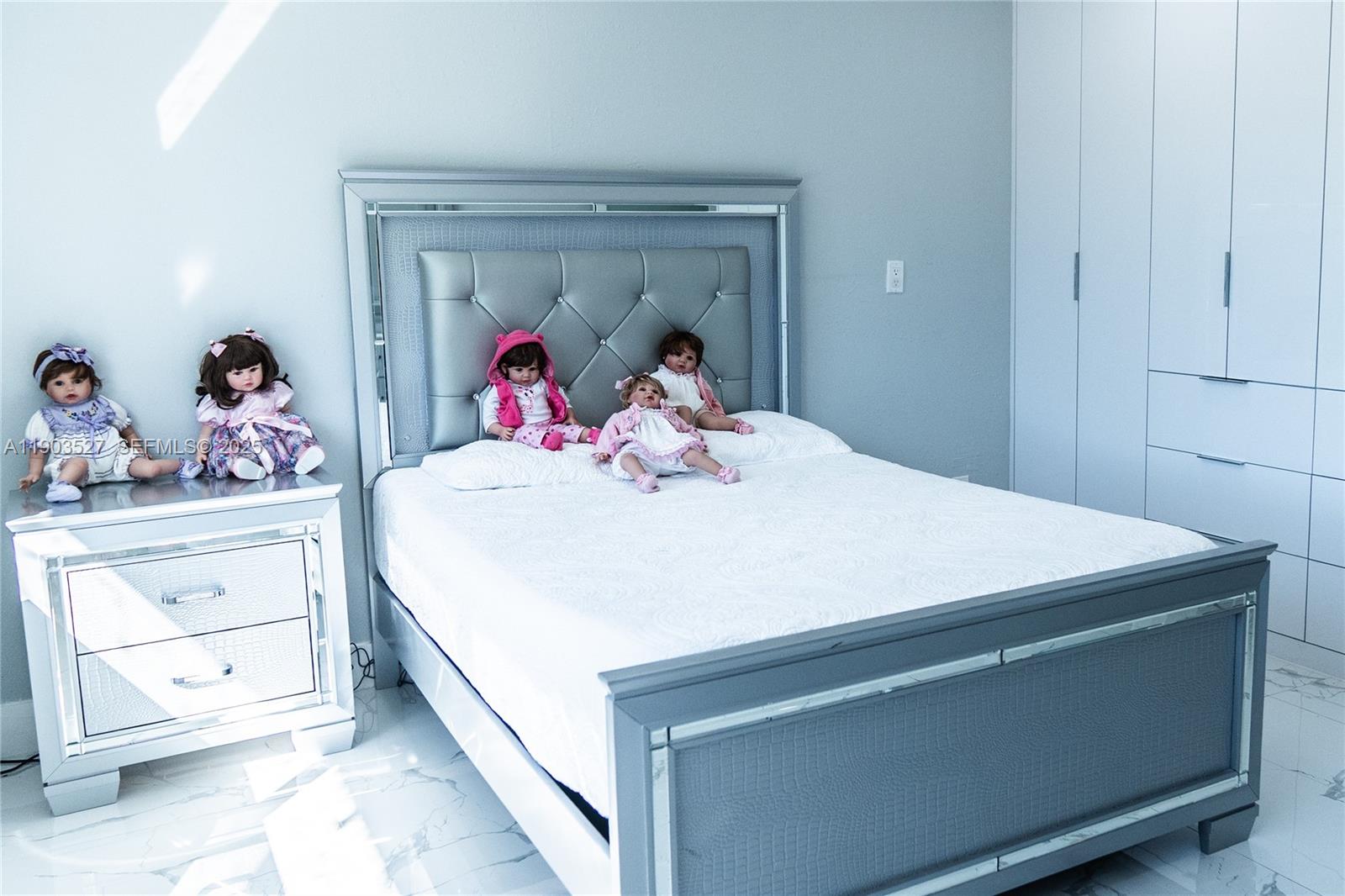 19245 Southwest 188th Street Miami, FL 33187 - Photo 30 of 38 a bed room with a bed and a baby crib