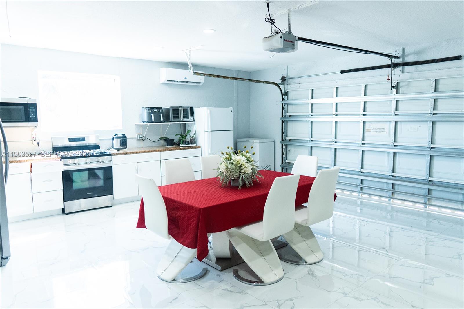 19245 Southwest 188th Street Miami, FL 33187 - Photo 32 of 38 a kitchen with a sink cabinets and appliances