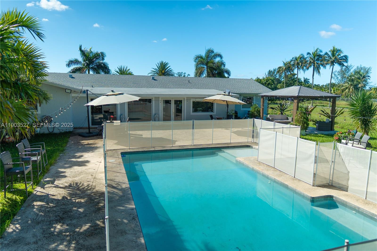 19245 Southwest 188th Street Miami, FL 33187 - Photo 35 of 38 a front view of a house with a yard