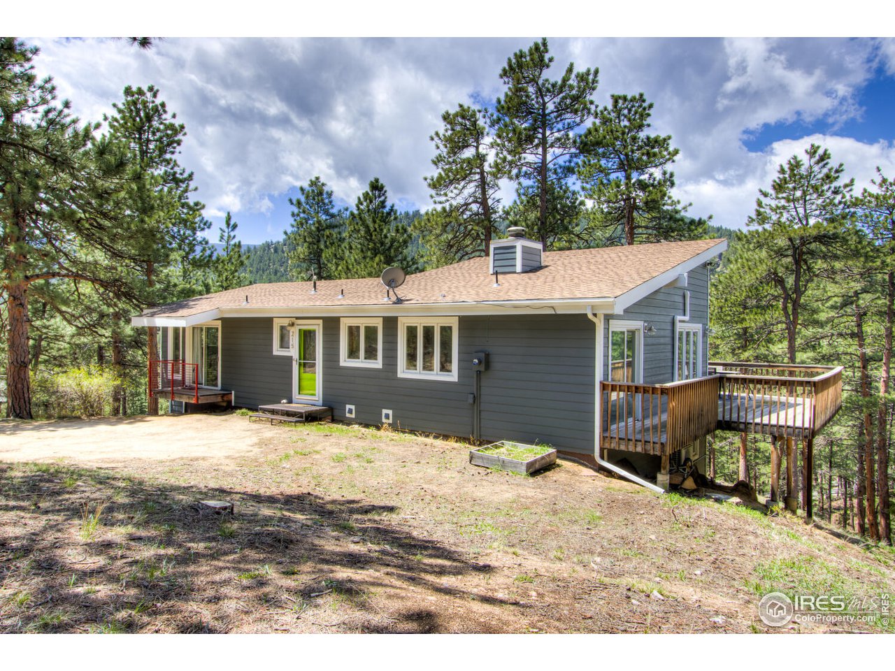 215 Broken Fence Road Boulder, CO 80302 - Photo 3 of 40 a view of a house with a yard