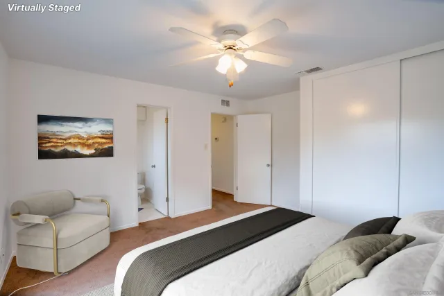 a bedroom with a bed and a couch