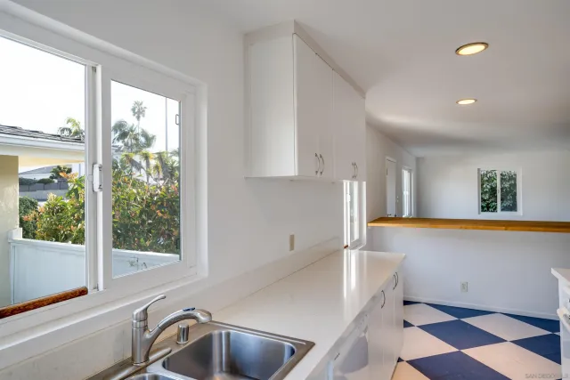 a kitchen with a sink and a window