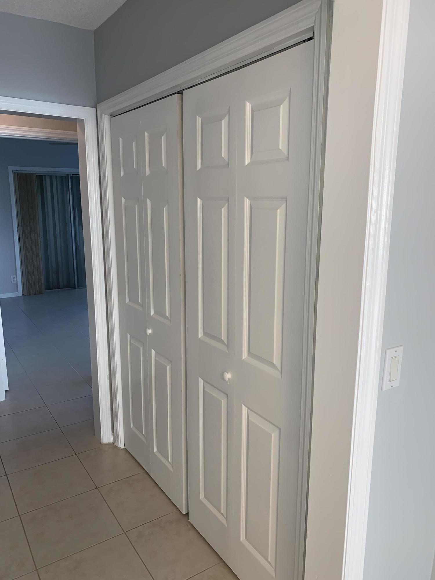6551 Northeast 7th Avenue, Unit B Boca Raton, FL 33487 - Photo 5 of 12 a view of a hallway with wooden floor