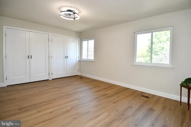 a view of entryway with wooden floor
