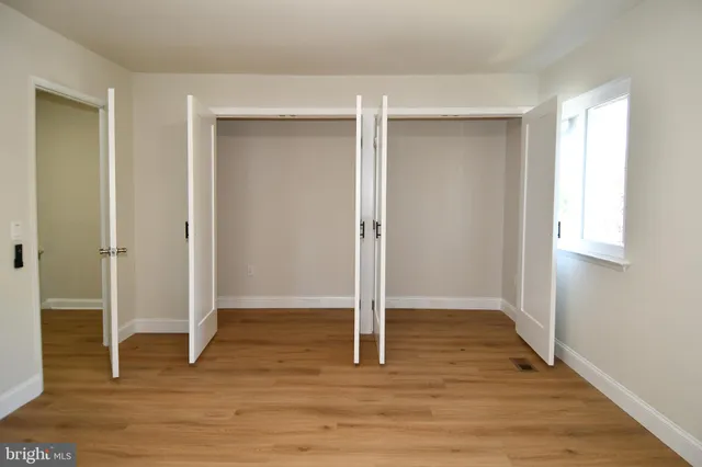 a bathroom with a sink vanity and a mirror