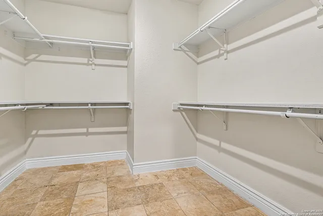 a view of an empty walk in closet