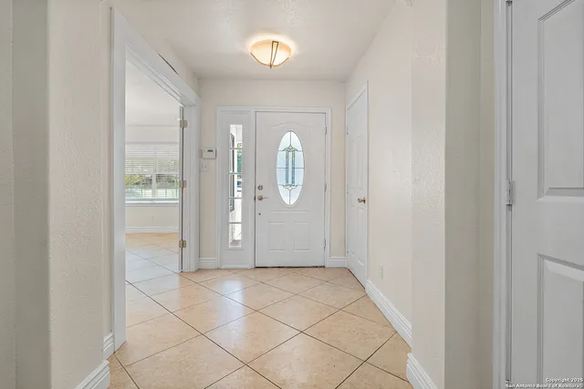 a view of an empty room with a mirror