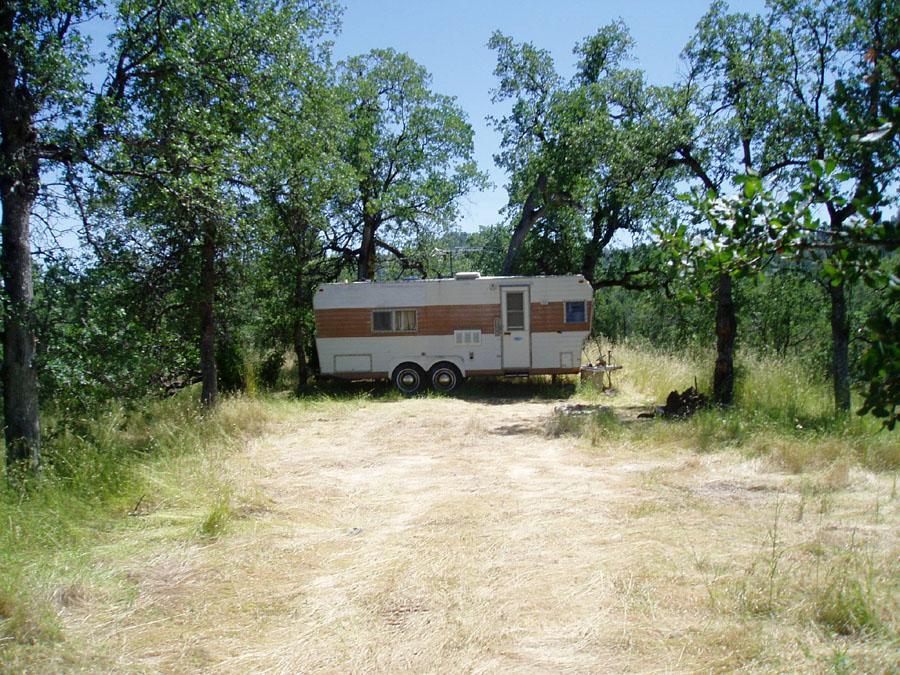 Lot 74 Straight Arrow Road Igo, CA 96047 - Photo 4 of 11 a house with trees in the background