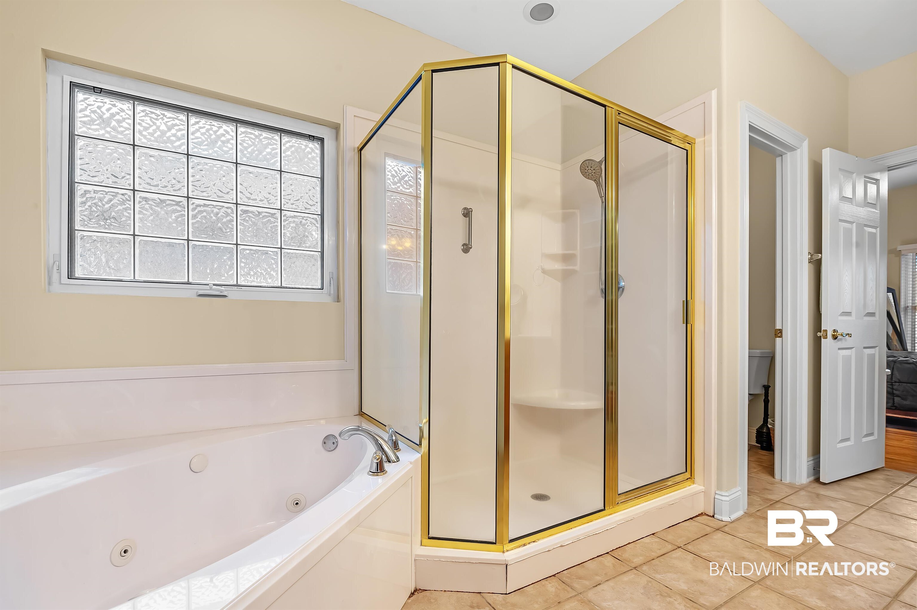 22726 Inverness Way Foley, AL 36535 - Photo 38 of 51 Bathroom featuring separate shower and tub and tile patterned floors