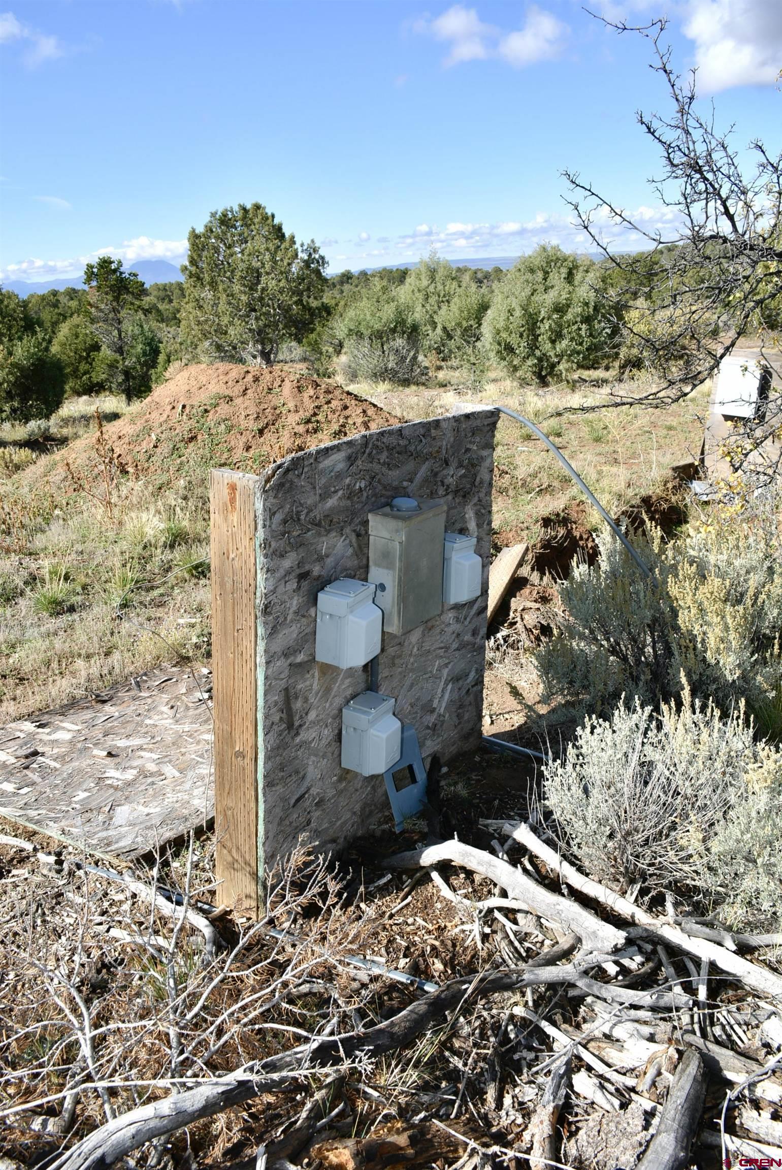 14421 32.1 Road Mancos, CO 81328 - Photo 21 of 30 a view of a wooden house with a yard