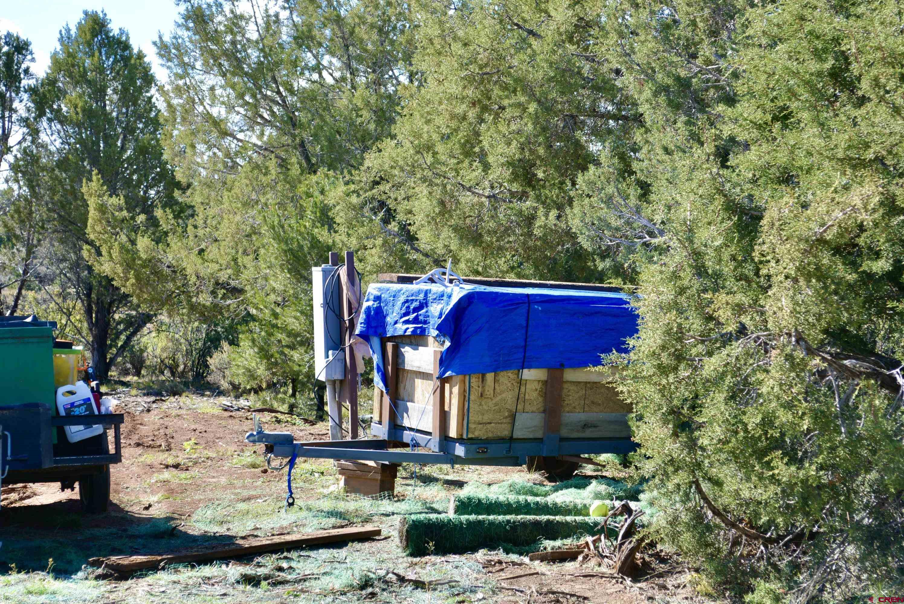 14421 32.1 Road Mancos, CO 81328 - Photo 8 of 30 a view of a house with a yard and sitting area