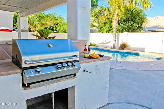 a view of a living room with a fireplace furniture and a large window