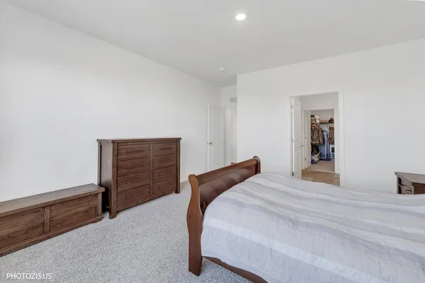 a bedroom with a bed and a cabinets