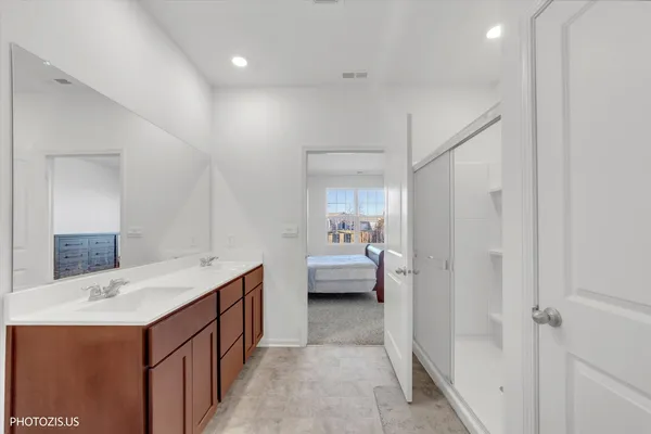 a bathroom with a sink a mirror and a vanity