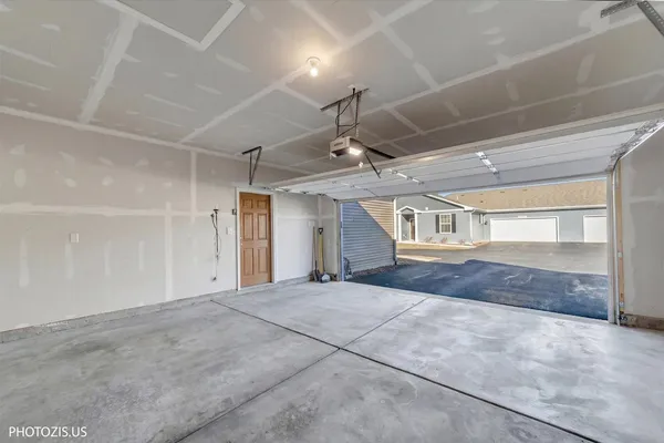 a big room with chandelier and windows