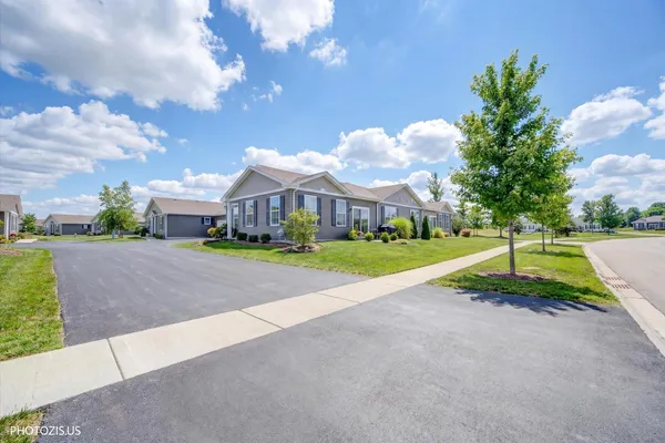 a view of house with outdoor space and street view