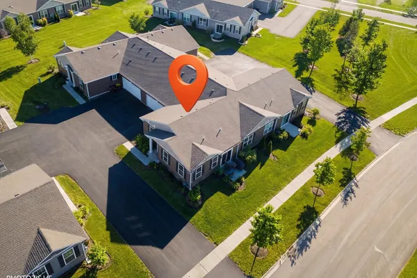 an aerial view of a house with a swimming pool