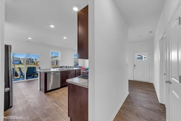 a view of a kitchen from the hallway
