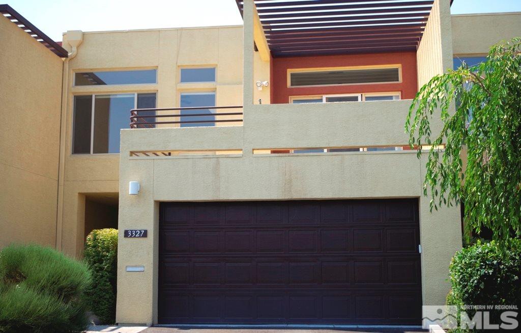 3327 Skyline Boulevard Reno, NV 89509 - Photo 1 of 17 a front view of a house with a garage