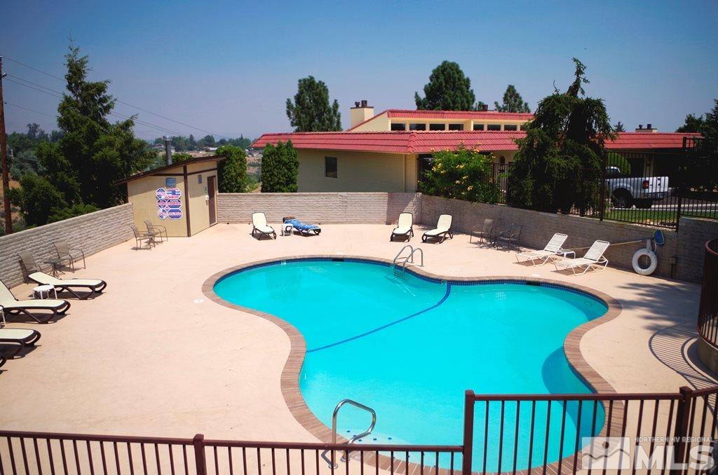 3327 Skyline Boulevard Reno, NV 89509 - Photo 17 of 17 a view of a patio with a table and chairs