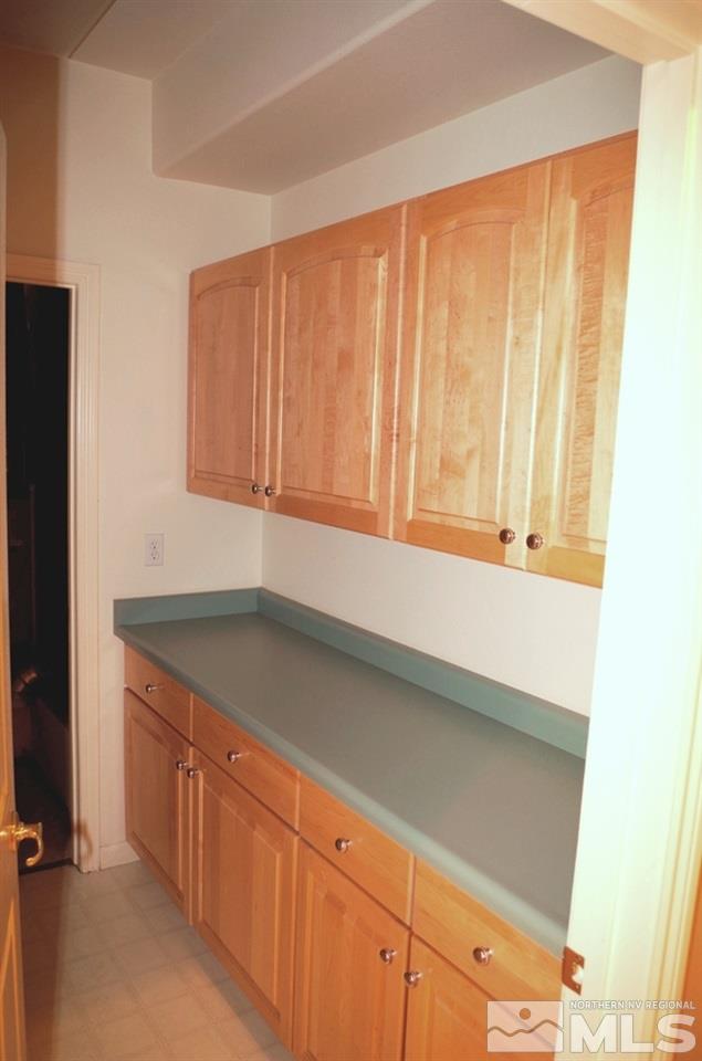 3327 Skyline Boulevard Reno, NV 89509 - Photo 6 of 17 a kitchen with granite countertop cabinets a sink and dishwasher