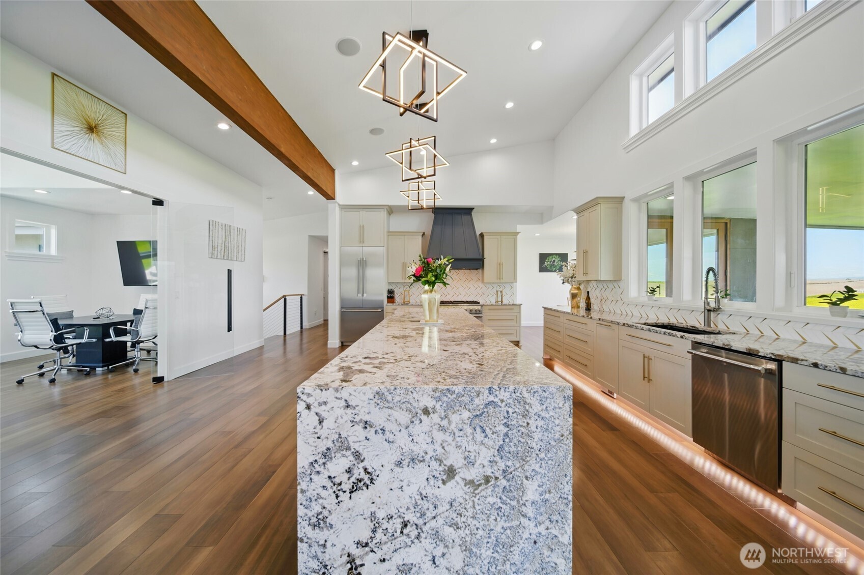 126 Red Hawk Road Walla Walla, WA 99362 - Photo 14 of 40 a large kitchen with kitchen island a stove a sink dishwasher a dining table and chairs with wooden floor