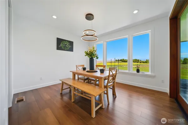 a dining room with furniture and window