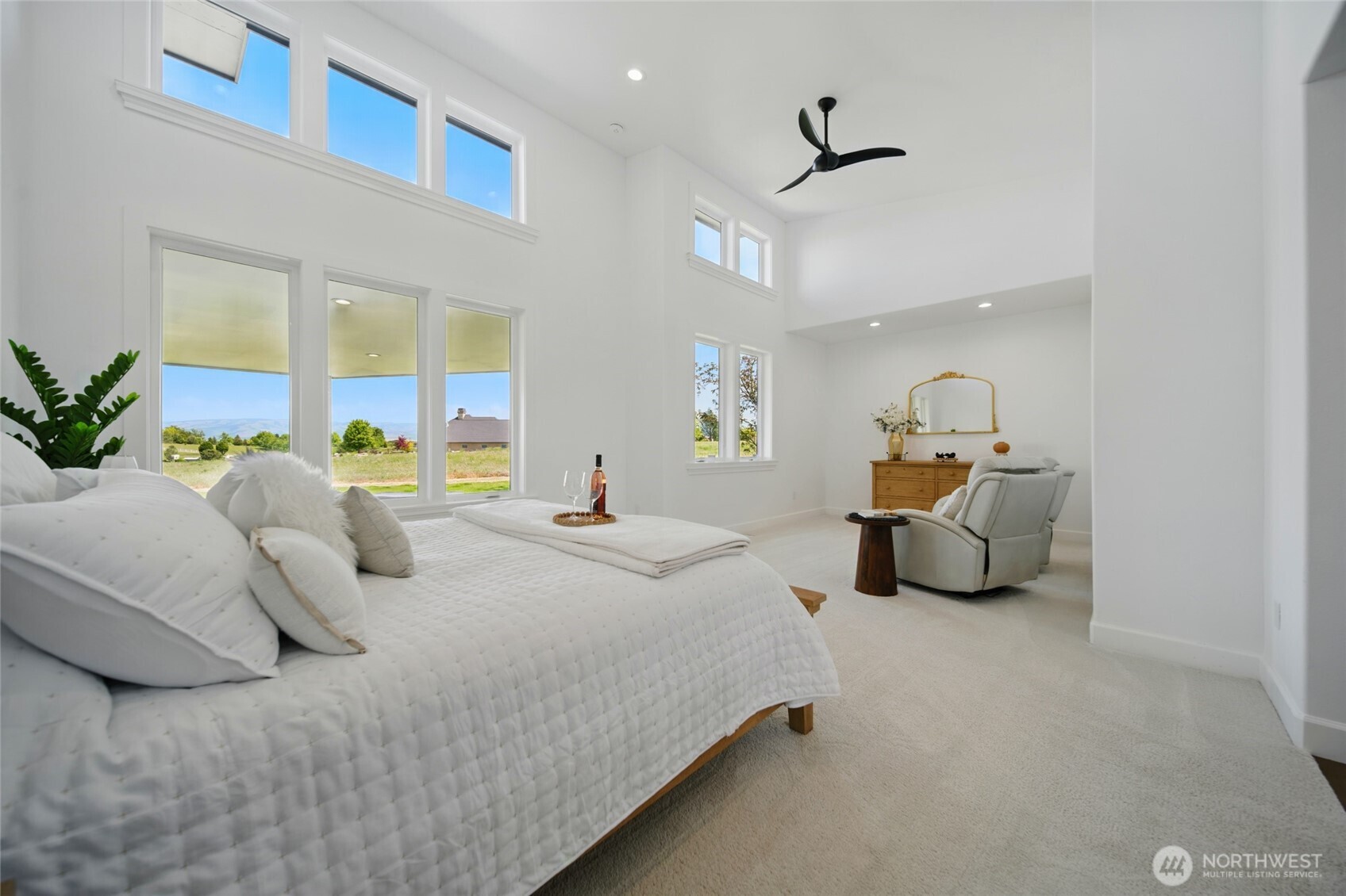 126 Red Hawk Road Walla Walla, WA 99362 - Photo 22 of 40 a bedroom with bed and a chandelier