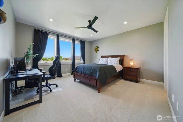 a bedroom with furniture and a chandelier