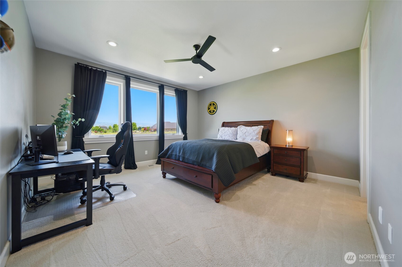 126 Red Hawk Road Walla Walla, WA 99362 - Photo 29 of 40 a bedroom with furniture and a chandelier